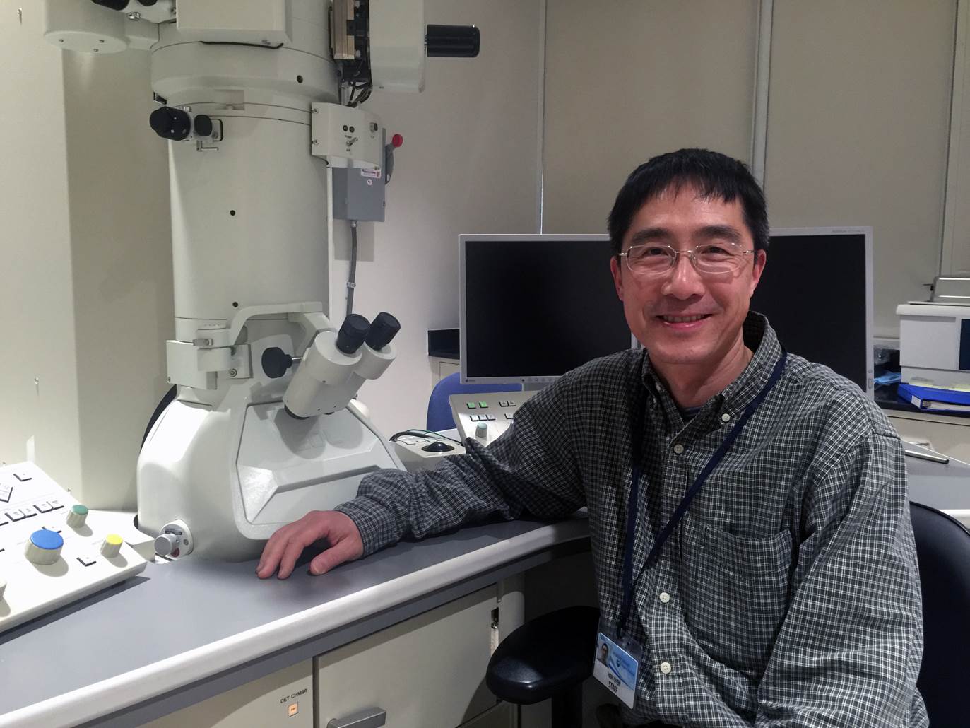 Han Chen, MD, PhD, became director of the Penn State College of Medicine Transmission Electron Microscopy Facility in February 2016. Chen is pictured at right, seated and facing the camera, with the microscopy equipment behind him to his left.