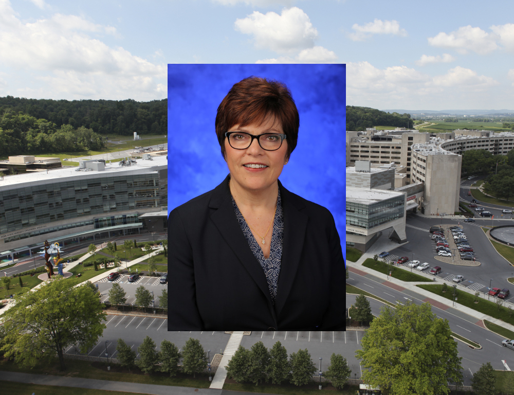 A headshot of Chief Nursing Officer Judy Himes superimposed on a wide shot of the Hershey Medical Center campus.