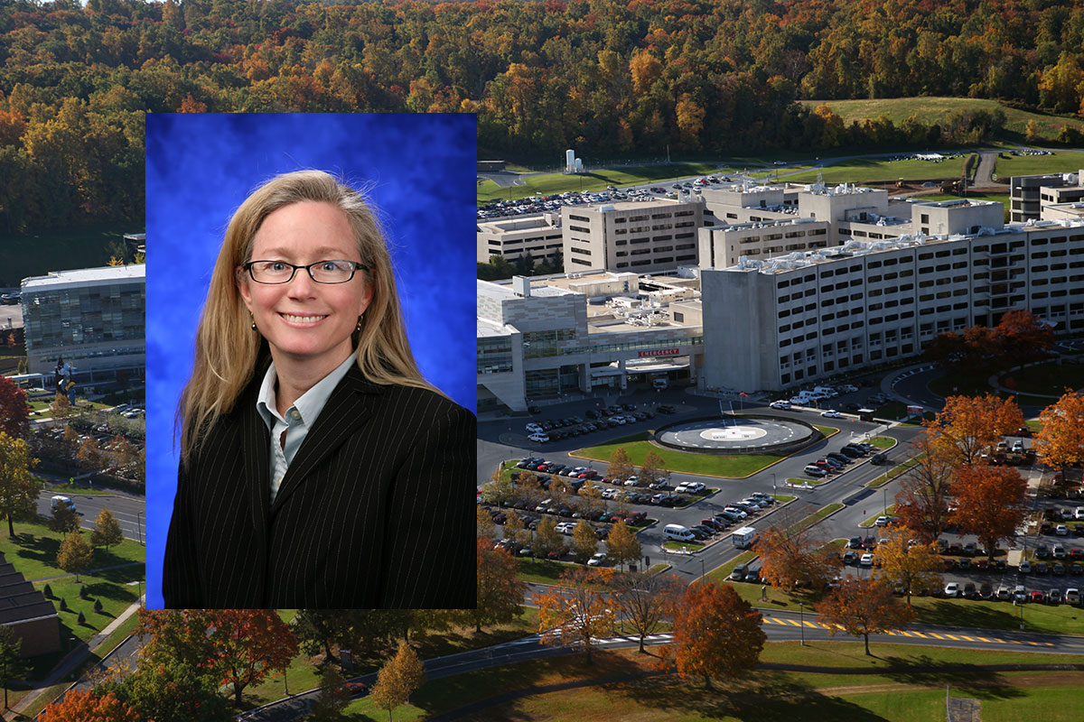 Dr. Patricia Sue Grigson, professor of neural and behavioral sciences at Penn State College of Medicine, was one of the recipients of the 2016 Dean™s Award for Excellence in Teaching. Grigson is pictured wearing a light-colored collared shirt and a black blazer, in front of a blue photo background. Her image is superimposed on the left side of an aerial photo of the Penn State College of Medicine campus in Hershey, PA, with the College's well-known Crescent visible at right.