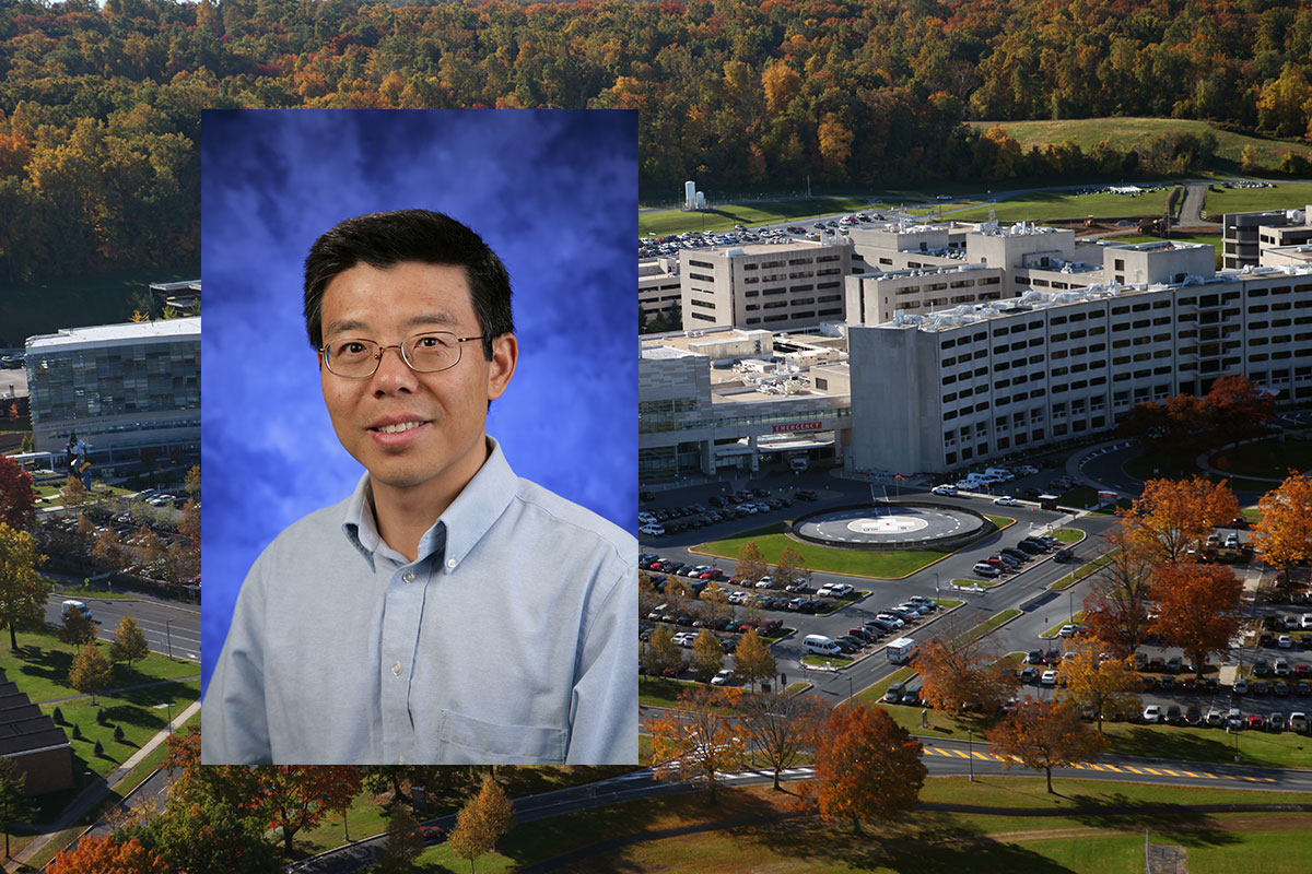 Dr. Rongling Wu, distinguished professor of public health sciences and statistics, and director, Center for Statistical Genetics, was recently named a Fellow of the American Association for the Advancement of Science. Wu is pictured in a blue dress shirt, in front of a deep blue photo background. His picture is overlaid on an aerial view of the Penn State College of Medicine campus.