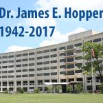 James E. Hopper, PhD, was a professor in the Department of Biochemistry and Molecular Biology at Penn State College of Medicine for many years. Dr. Hopper's photo pictures him wearing a collared shirt and sweater, and his photo is overlaid on an image of Penn State College of Medicine's Crescent building. The words Dr. James E. Hopper, 1942-2017, appear at the top of the photo.