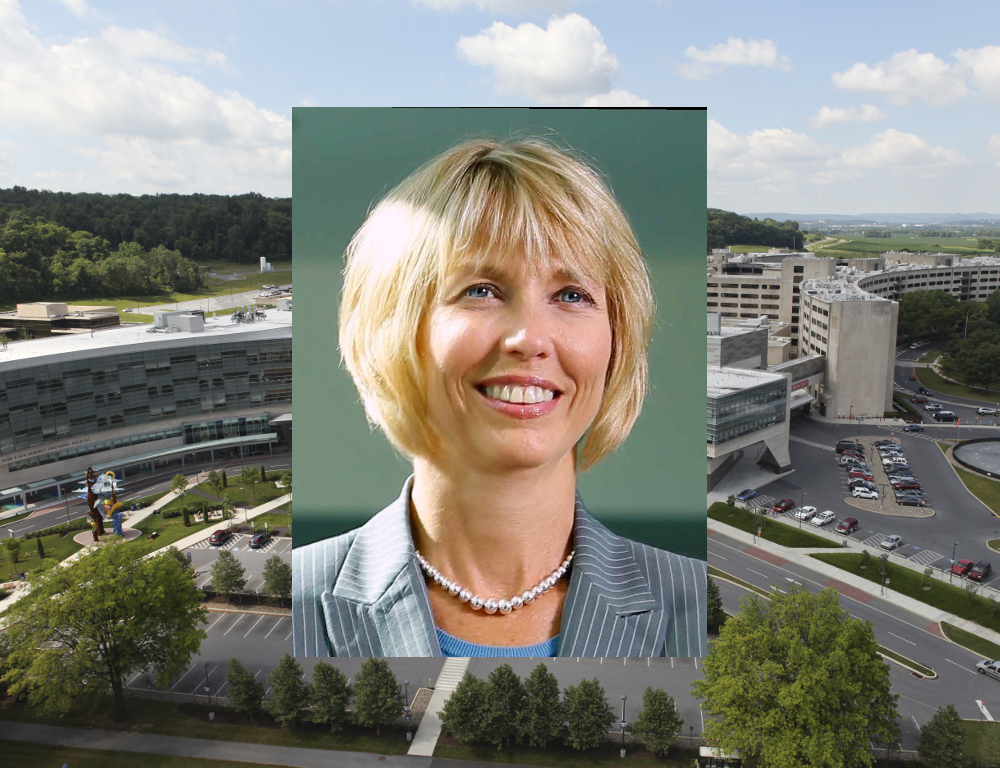 A stock photo of Kimberly Lansford in professional attire, superimposed over a wide aerial shot of the Medical Center - College of Medicine campus.