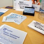 A promotional image for Penn State Clinical and Translational Science Institute shows a number of pamplets, cards and other items advertising CTSI services spread out on a table.