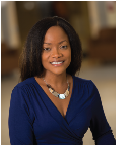 A professional head-and-shoulders shot pictures Nicole Woods wearing a necklace and dress blouse.