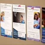 Posters depicting Penn State College of Medicine clinical trials that are seeking volunteers are displayed on a bulletin board.