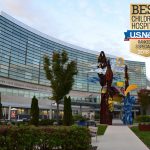 A view of the front of the Penn State Health Children's Hospital building. A gold and blue badge reading "Best Children's Hospitals/U.S. News/Ranked in three specialties, 2018-2019.
