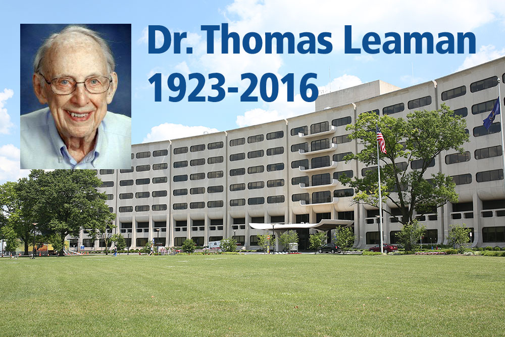 Dr. Thomas Leaman was the founding chair of the Department of Family and Community Medicine at Penn State College of Medicine. Dr. Leaman's photo pictures him wearing a collared shirt, and his photo is overlaid on an image of Penn State College of Medicine's Crescent building. The words Dr. Thomas Leaman, 1923-2016, appear at the top of the photo.