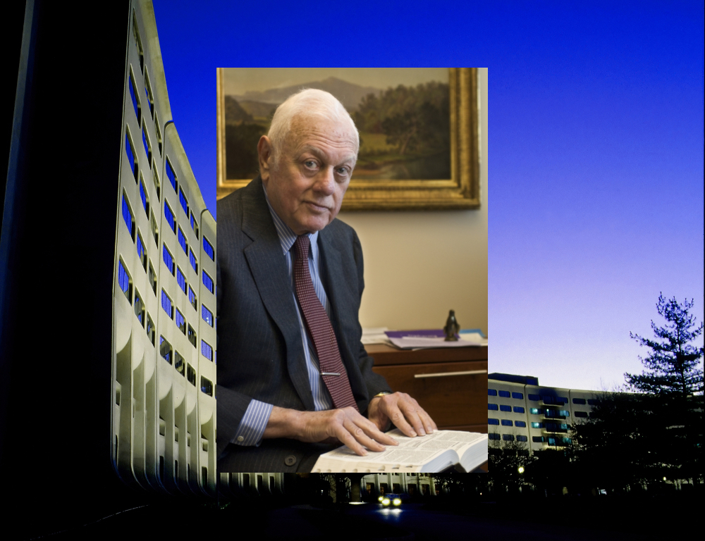 An image of Dr. Elliot Vesell reading a book is superimposed over an image of the Medical Center/College of Medicine building's signature Crescent.