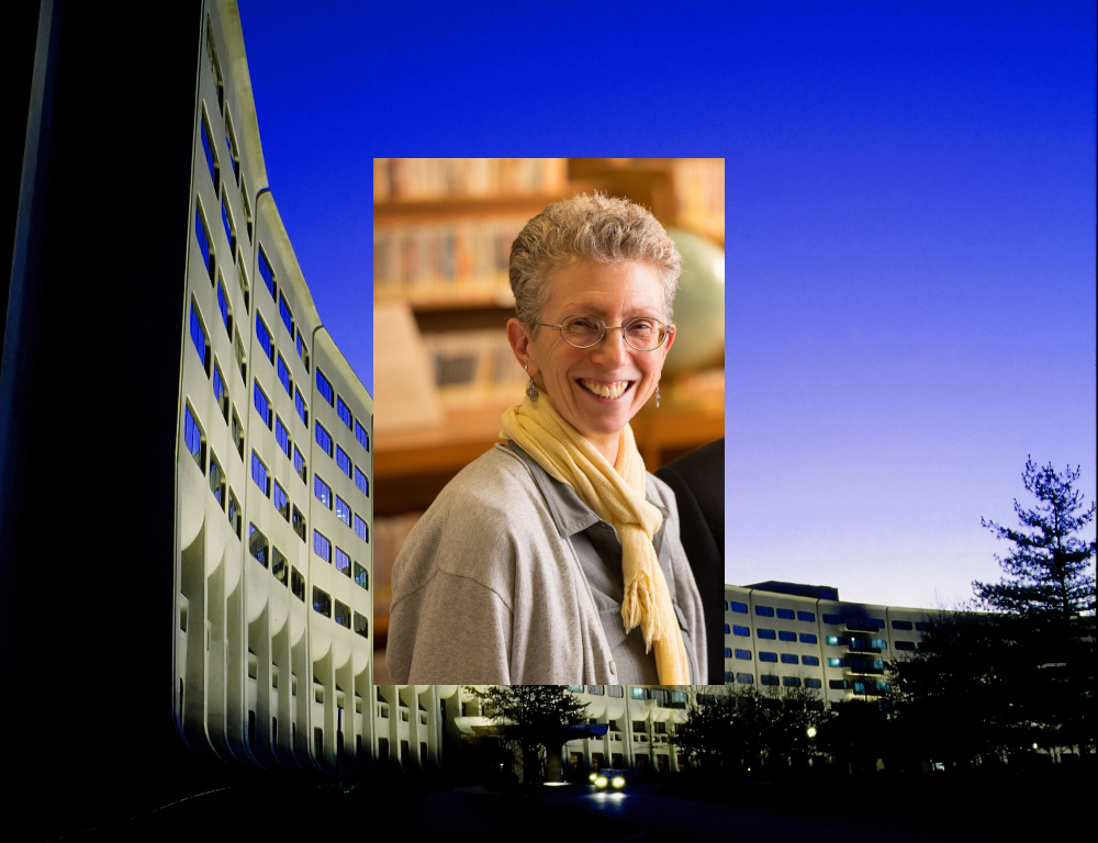 A woman with short hair and classes smiles for a photo in front of a bookshelf. The photo is superimposed over a photo of Penn State College of Medicine.