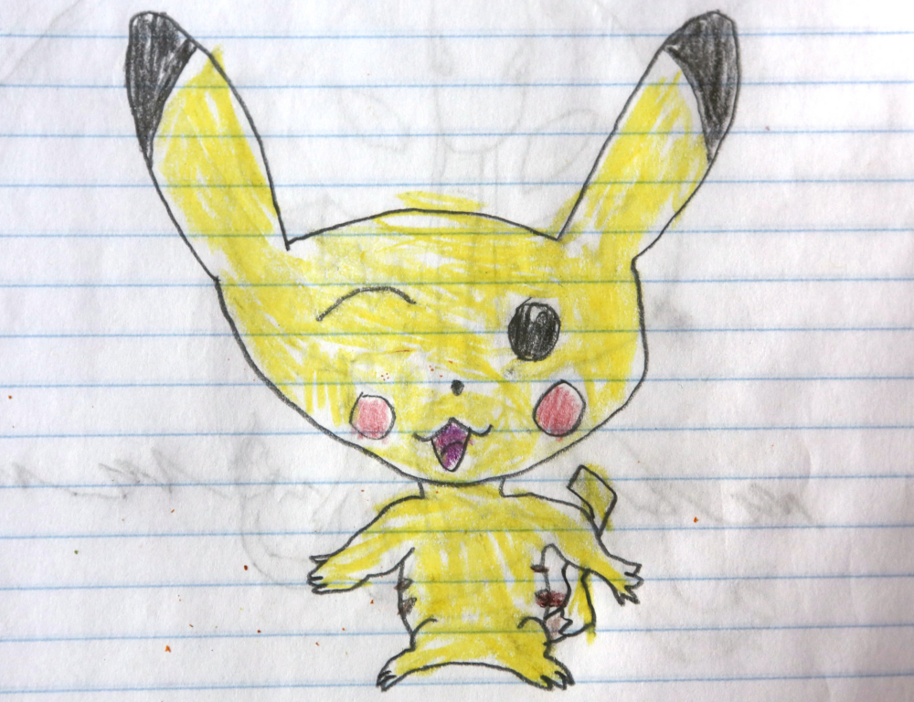A child's drawing depicts a yellow, long-eared creature, in crayon on white lined notebook paper.