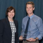 Dr. Steven Hicks, seen here receiving the 2018 Distinguished Early Stage Investigator Award earlier this year from Dr. Leslie Parent, vice dean for research and graduate studies, Penn State College of Medicine, recently joined Penn State Clinical and Translational Science Institute's KL2 training program. Hicks and Parent are pictured standing side-by-side, and Hicks is holding a clear award.