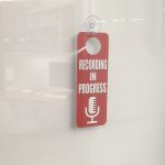 "Recording in Progress" sign on door of the One Button Studio.