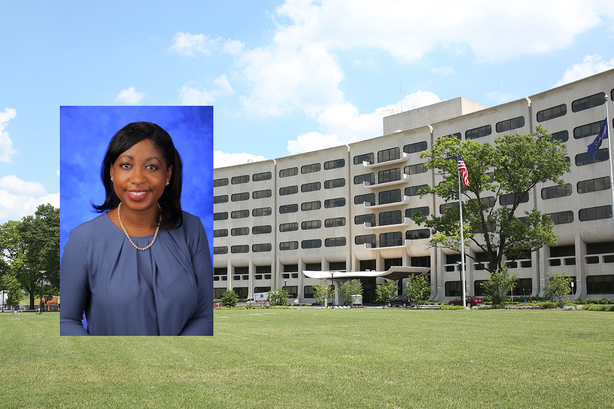 A head-and-shoulders professional photo of Yendelela Cuffee, PhD, MPH, is superimposed on a picture of Penn State College of Medicine's Crescent building in Hershey, PA.