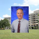 A head-and-shoulders professional photo of Dr. Douglas Leslie is superimposed on an image of Penn State College of Medicine's Crescent building in Hershey, PA.