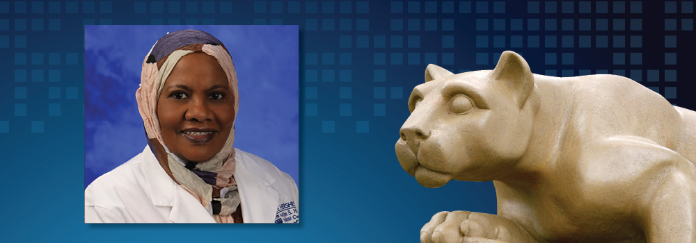 Dr. Alawia Suliman is pictured next to an image of the Penn State Nittany Lion statue.