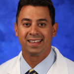 A head-and-shoulders professional picture of Aman Dhawan, MD