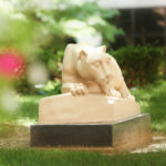 Penn State College of Medicine's Nittany lion statue is seen in a courtyard in the spring.