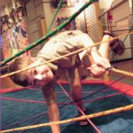 A child ducks through ropes in a room with displays on the wall. Next to him are the words Mazes & Brain Games Opening January 18. Sponsored by Highmark and Penn State Health.