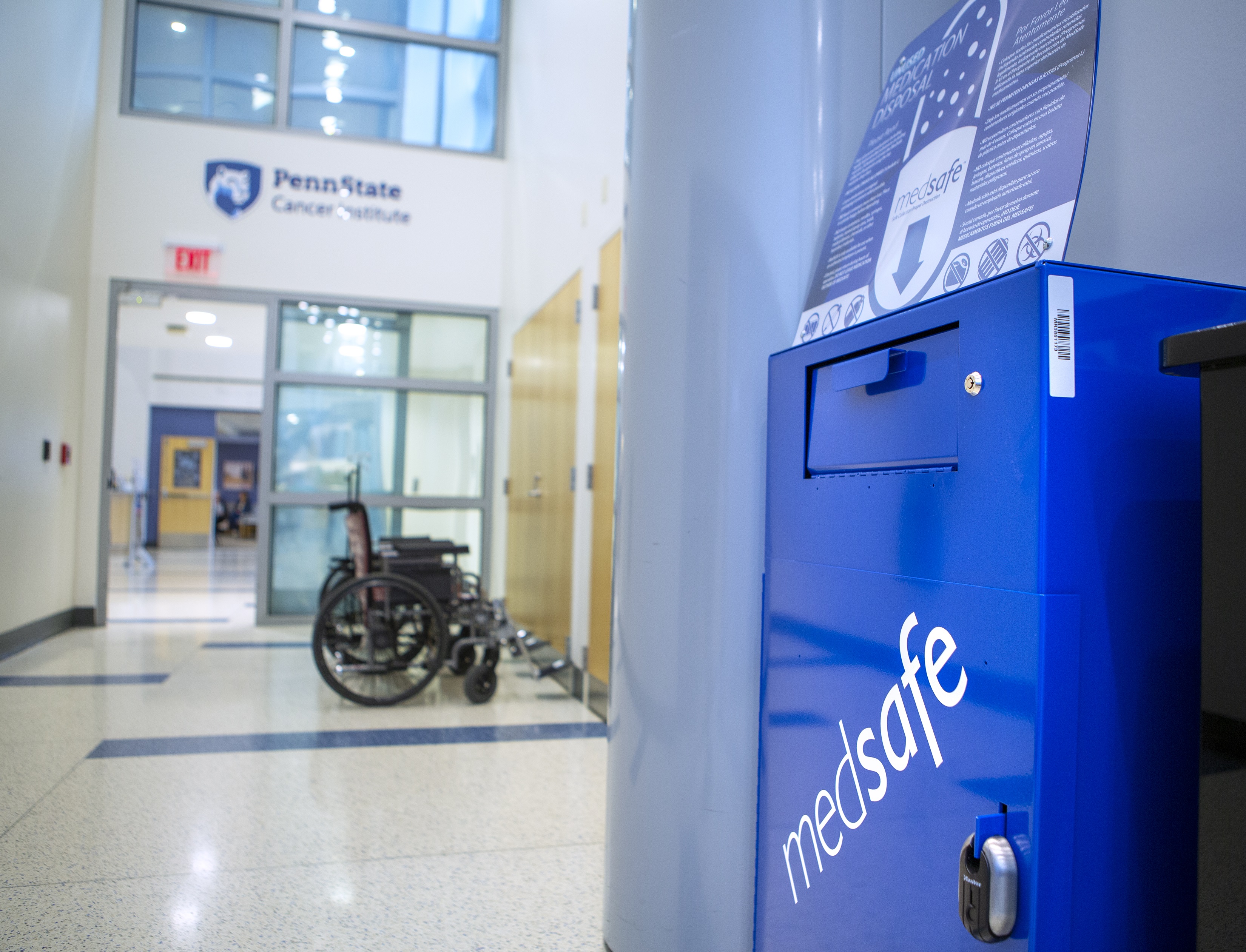 A box with the word “medsafe” written diagonally across the front sits in a hallway outside the Penn State Cancer Institute.