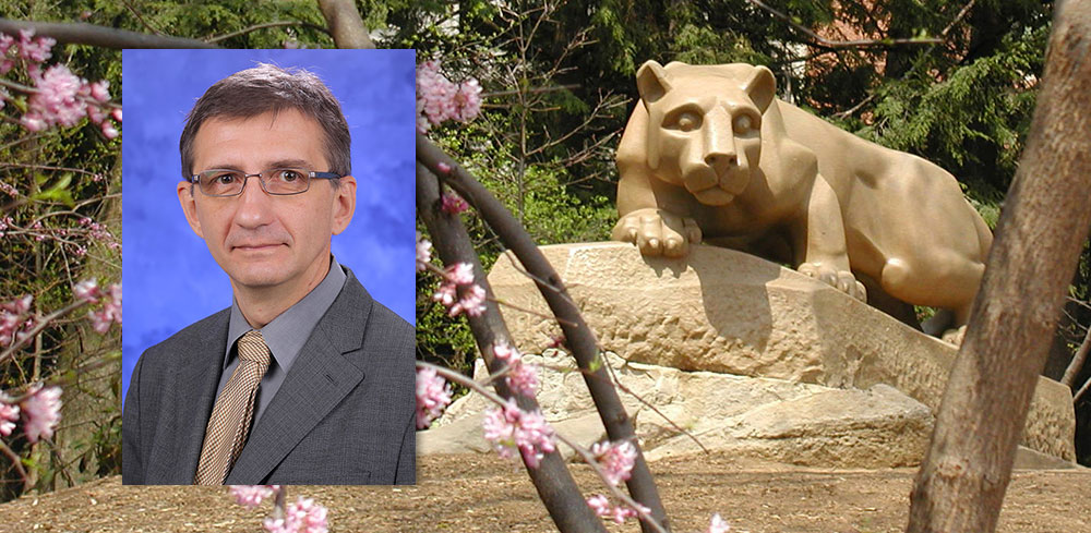 A head-and-shoulders professional photo of Dr. Nikolay Dokholyan is superimposed on a photo of Penn State's Nittany Lion statue.