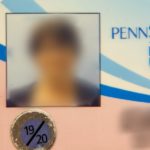 The pink ID badge is shown in a photo.