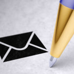 A close up of a pen point is shown near an image of an email icon.