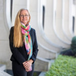 Dr. Patricia Sue Grigson stands outside Penn State College of Medicine in a professional portrait.