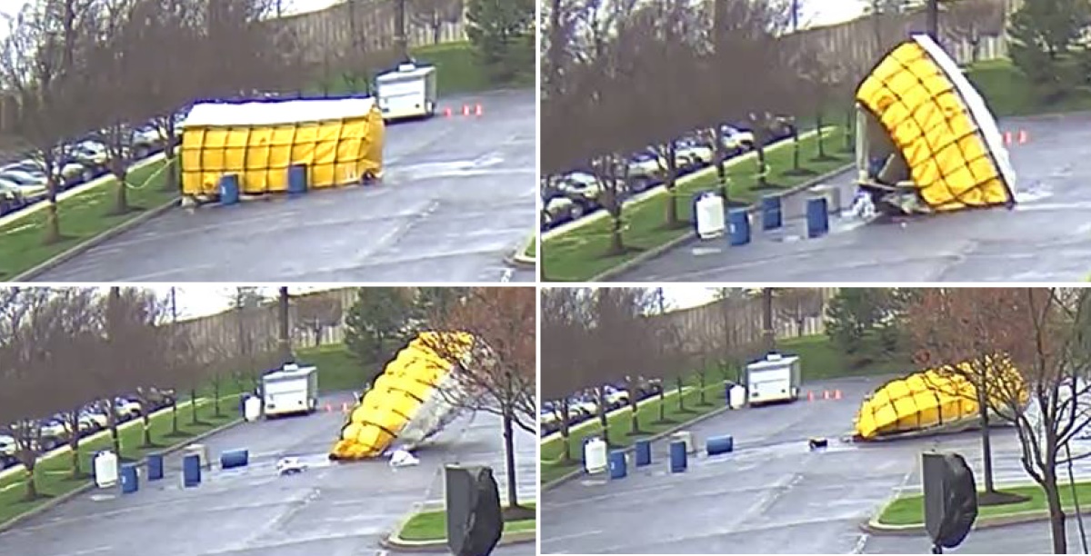 Four different images show a large tent being knocked down by high winds. Barrels and trees are in the foreground.