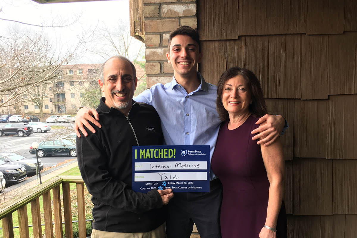 A fourth-year medical student celebrates being matched with his parents.