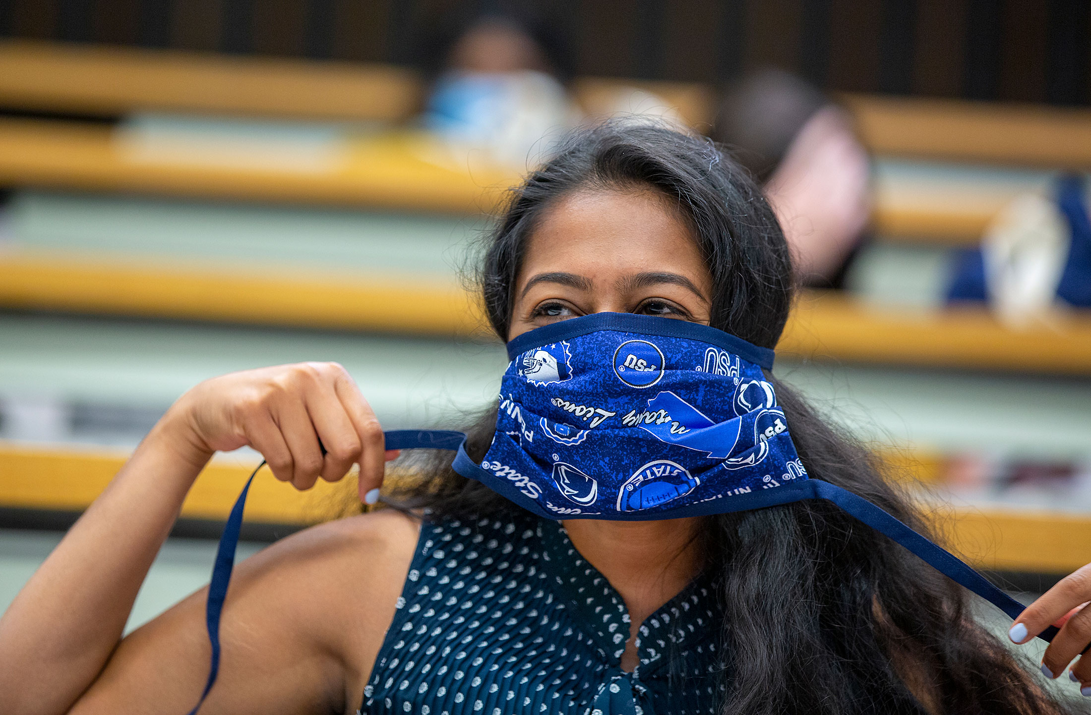 A first-year medical student wears a Penn-State themed mask during the incoming class of 2020 orientation on July 15.