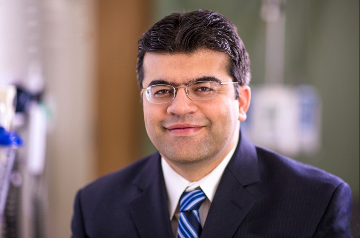 Dr. Faisal Aziz, vascular surgeon with Penn State Heart and Vascular Institute, wearing a suit and tie.