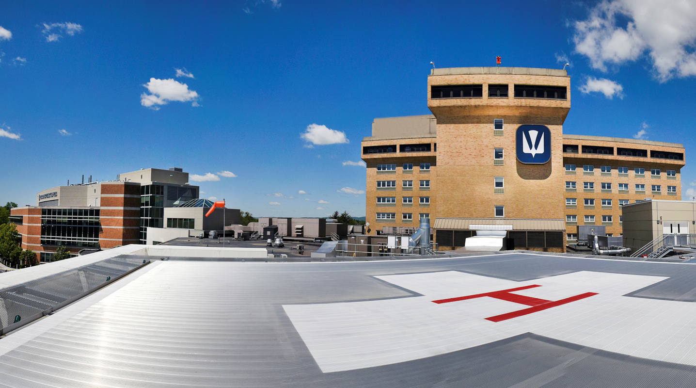 From the vantage point of a rooftop helipad, the Holy Spirit Hospital bed towers rise to the right while the Ortenzio Heart Center is at left.