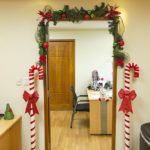 Door frame with Christmas decoration in the office.