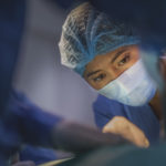 Low angle view of a nurse in a surgical setting.