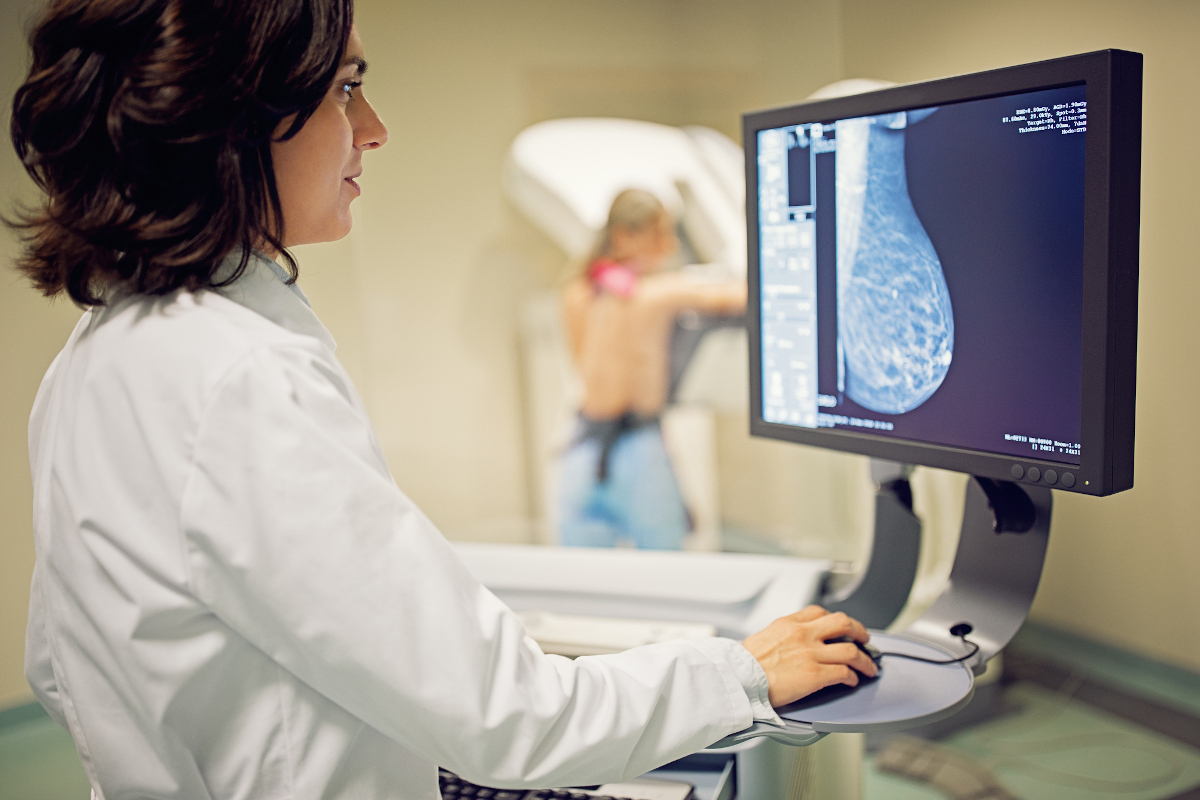 Doctor is working with mammography X-ray scanner in hospital