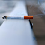 Photo shows a lit cigarette