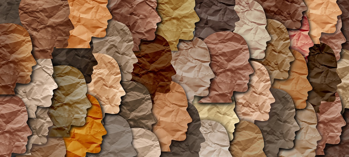 Paper cut out drawings of faces in profile are featured in various skin-tone shades.