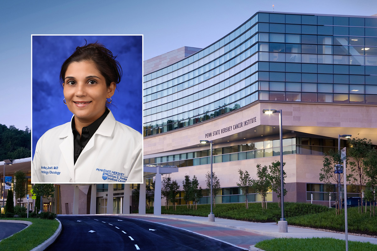 A head and shoulders professional portrait of Monika Joshi, against a background image of Penn State Cancer Institute