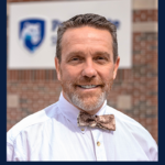 A head-and-shoulders professional photo of Dr. George Garrow in a bowtie is seen with the logo for Penn State Clinical and Translational Science Institute's 5 Questions series.