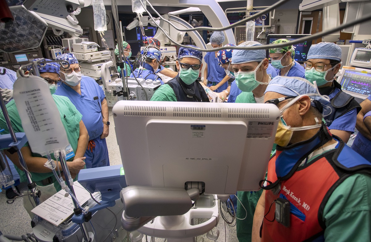 A team of cardiology, cardiothoracic surgery and anesthesia clinicians wear scrubs, masks and caps during a procedure in the Operating Room at Penn State Health Milton S. Hershey Medical Center in December 2020.