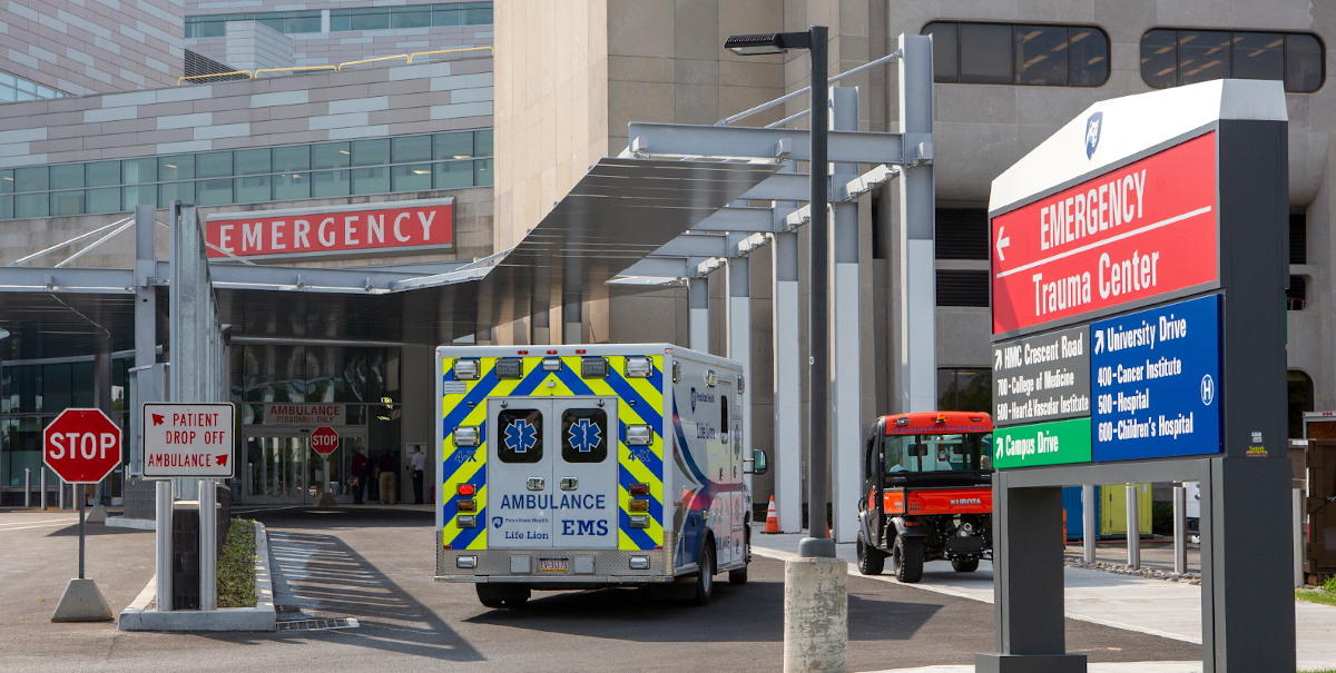 An ambulance sits outside of an emergency department