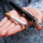 closeup of hand of woman with e-cigarette