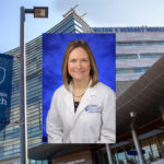 A head-and-shoulders portrait of Dr. April Armstrong over a background of Penn State Health Milton S. Hershey Medical Center