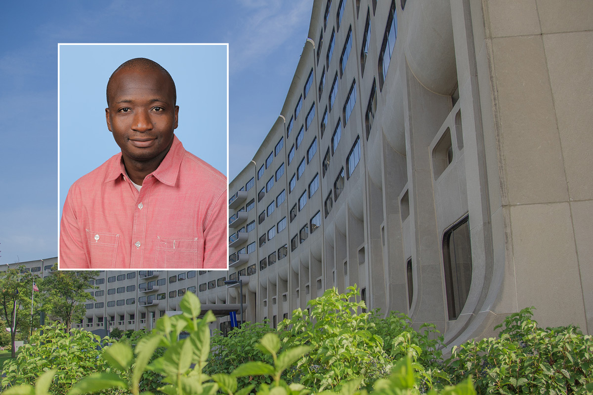 A head and shoulders professional portrait of Djibril Ba against a background image of Penn State College of Medicine.