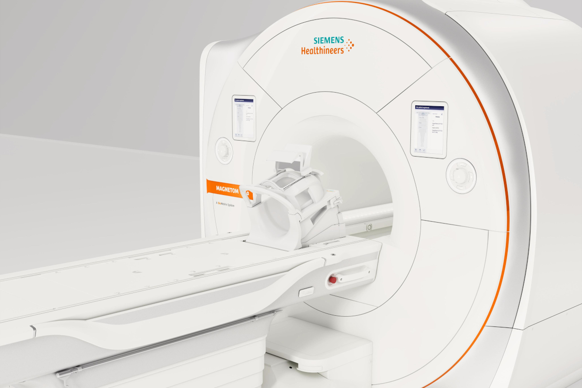 An MRI machine sits in a plain-looking room.