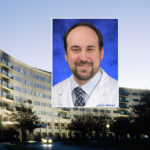 A head and shoulders professional portrait of Gregory Lewis against a background photo of Penn State College of Medicine