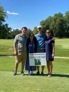 Louis Borgatta, Rachel White, Frank Weigel and Kayla Hartz stand outside on a golf course
