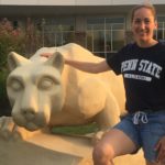 Susan Thurman, a critical care physician assistant, stands outside next to the Penn State Nittany lion statue.