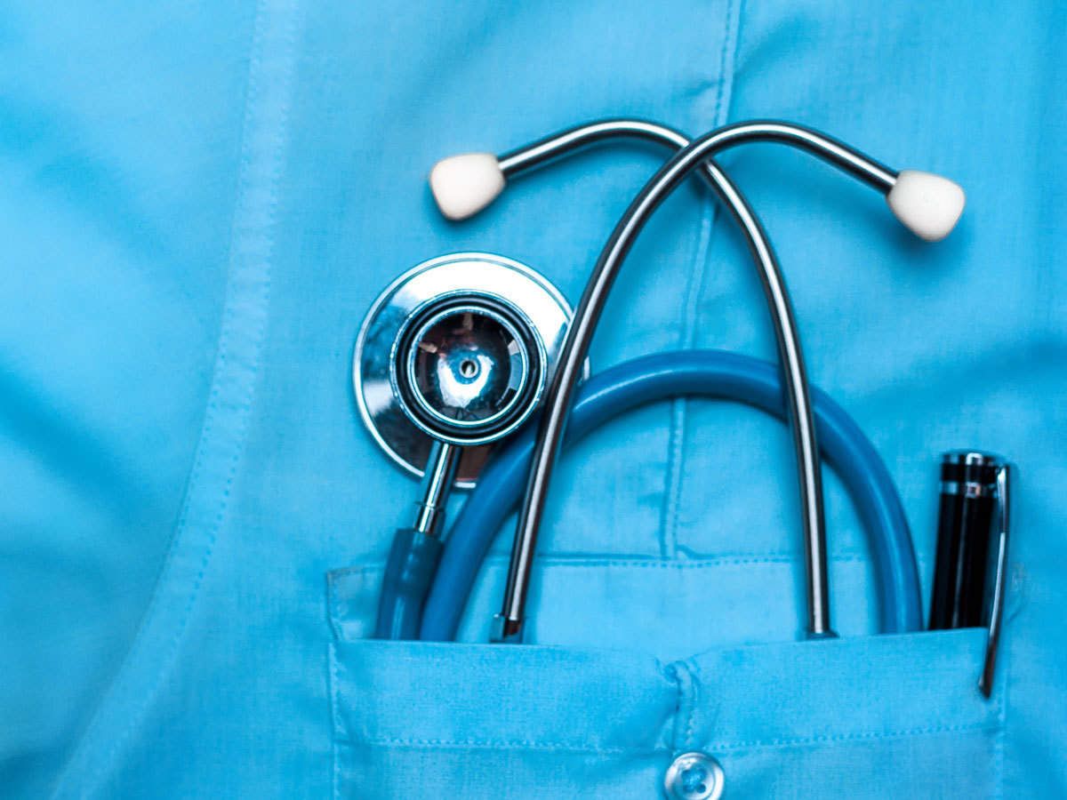Picture of a doctor’s uniform shirt pocket with a stethoscope in the pocket.