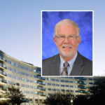 A head and shoulders professional portrait of Bruce Stanley against a background image of Penn State College of Medicine.